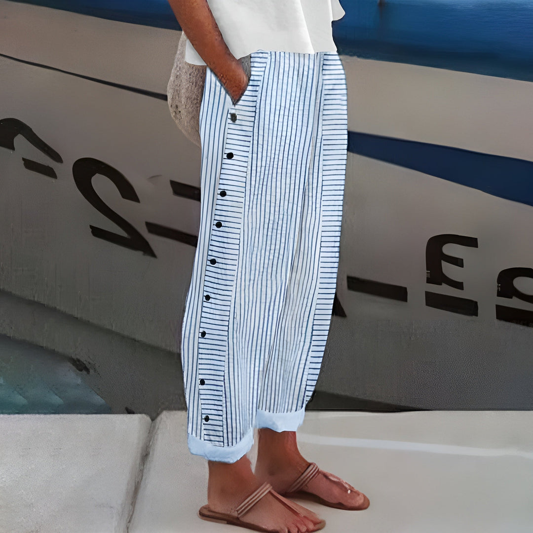 Amika | Gestreepte 7/8-broek met knopenrij opzij voor dames