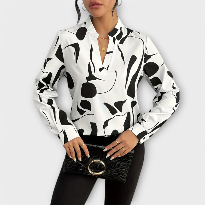 Edith - Elegante blouse met lange mouwen en spitse hals